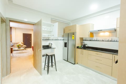 Executive Apartment, 3 Bedrooms | Private kitchen | Full-size fridge, microwave, oven, stovetop