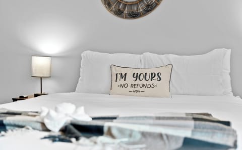 Master bedroom with a queen bed. diff pillows styles, comfy sheets and linens