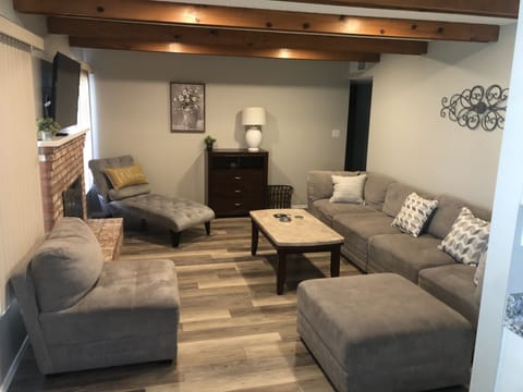 Den with plenty of seating, 50” smart fire tv and gas fireplace 