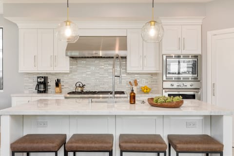 Barstool seating at the kitchen.