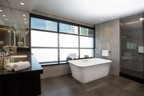 Suite, 1 King Bed | Bathroom | Hair dryer, bathrobes, towels