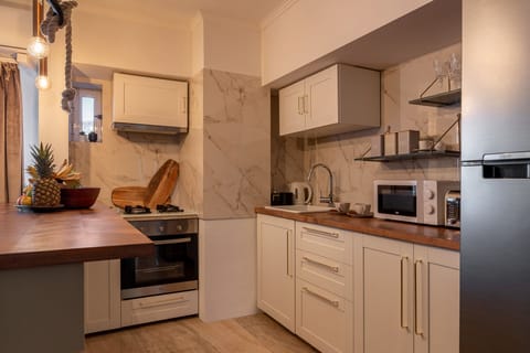 Comfort Apartment | Private kitchen | Full-size fridge, microwave, oven, stovetop