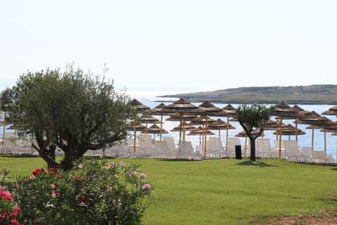 Private beach, white sand, sun loungers, beach umbrellas