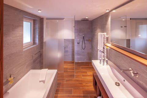 Classic Suite | Bathroom | Designer toiletries, hair dryer, bathrobes, slippers