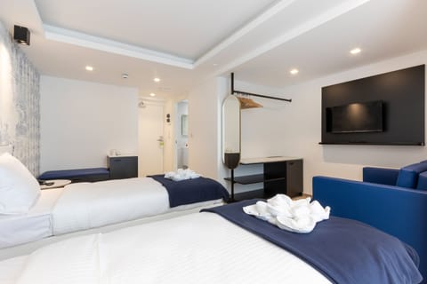 Twin Room with Private Bathroom | Blackout drapes, soundproofing, iron/ironing board, free WiFi