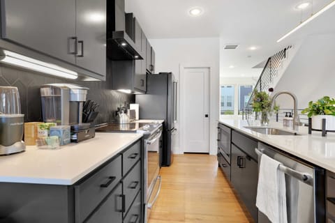 Fully stocked kitchen with Keurig, tea kettle, nutribullet, and more