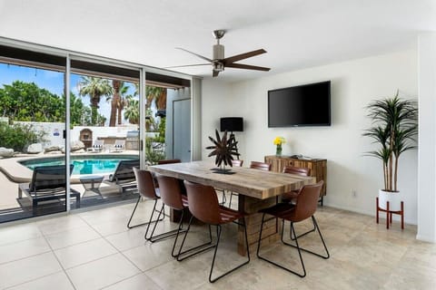 A beautifully designed dining area with a touch of mid-century modern inspiration