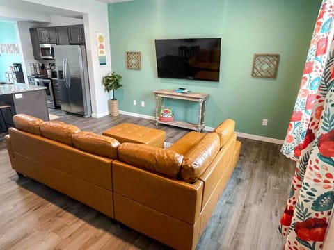 Living Room with open flow to kitchen and dining, lots of natural light.