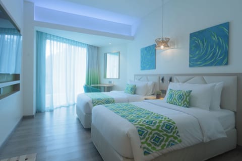 Deluxe Room Partial Seaview | Minibar, in-room safe, desk, free WiFi