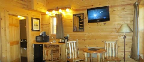 Cabin, Multiple Beds (Jacuzzi ) | Living area | 32-inch TV with cable channels