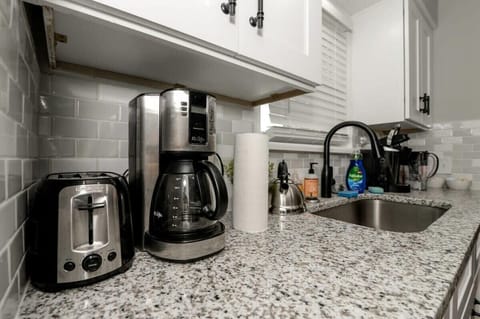 Countertop with Coffee Maker and Toaster
Start your day right with a fully equipped countertop featuring a coffee maker and toaster. Whether it’s a morning brew or a quick breakfast, everything you need is right at your fingertips.