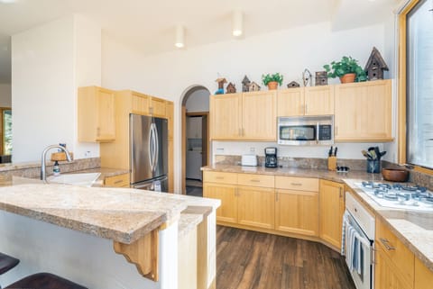 Bright, open kitchen, well-appointed with tons of storage