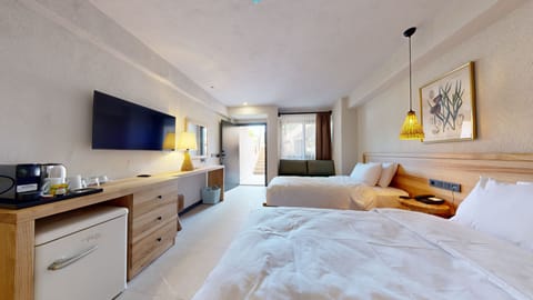 Junior Twin Room, Ground Floor | Minibar, in-room safe, laptop workspace, soundproofing