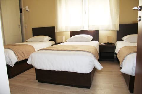 Economy Triple Room | In-room safe, free WiFi