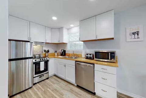 Both kitchens at the Getaway are furnished with gleaming new appliances, including a dishwasher and K-Cup coffee maker.