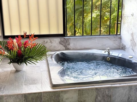 Treehouse Bungalow | Bathroom | Hydromassage showerhead, free toiletries, hair dryer, towels