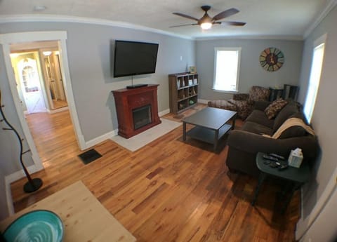 Living Room from front door. Pull out couch, big comfy chair, flat screen, fireplace, games, books, dvd's and toys!
