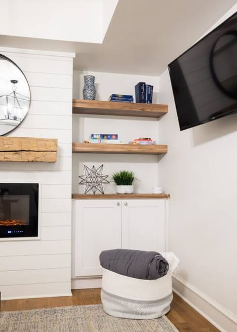 Play games or watch TV by logging into the Amazon Fire Stick. Additional bedding for the sleeper sofa is located in the basket and cupboard.