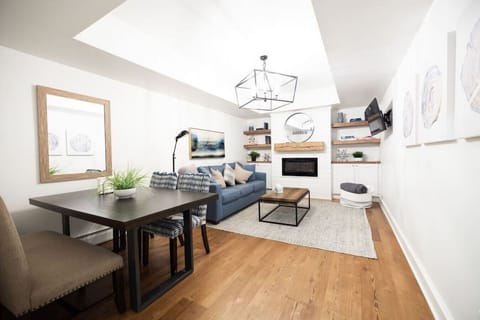 Cozy up in the Clark Suite living area for dinner or watching movies. The living room features an electronic fireplace and pull out sofa bed for extra guests.