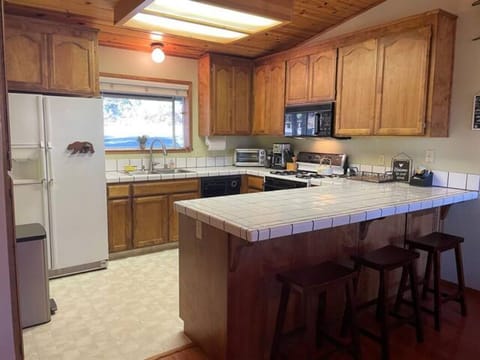 Kitchen with counter-height seating and all the necessities!