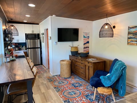 Small living space off kitchen with TV