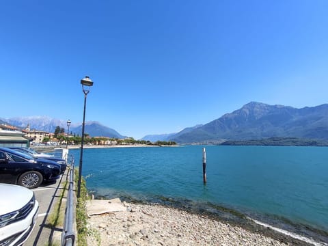 Water, Sky, Mountain, Vehicle, Car, Azure, Street Light, Lake, Wheel