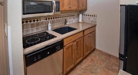 Suite, 1 Bedroom | Private kitchen | Full-size fridge, microwave, stovetop, dishwasher