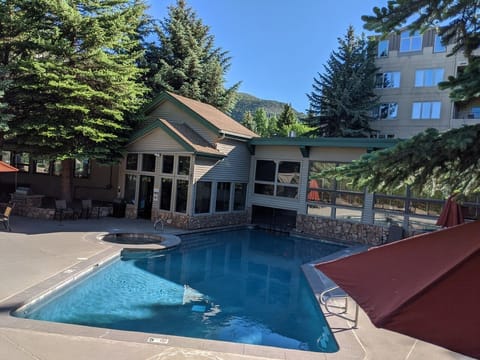 Outdoor pool, pool umbrellas, sun loungers