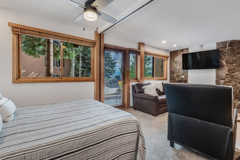 Queen bed with collapsible wall to separate from living area