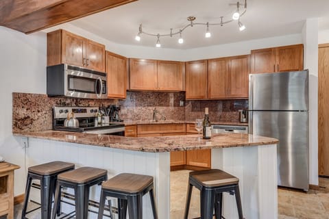 Full kitchen with bar seating