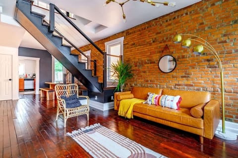 Relax in a spacious living room adorned with lush indoor plants and high-end fixtures, The elegant touches and spacious layout make it the perfect place to unwind