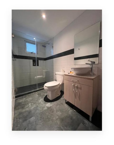 Standard Shared Dormitory, 1 Queen Bed | Bathroom | Shower, rainfall showerhead, towels