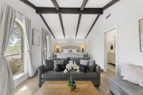 [Master bedroom] King bed, lounge area with 65" TV & ensuite bathroom