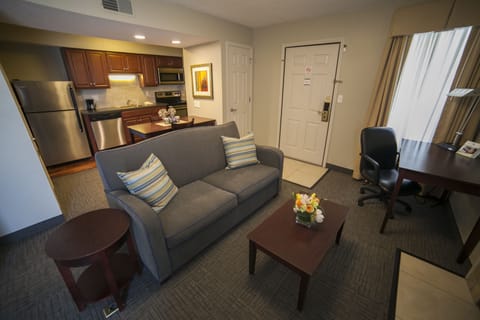 Standard Suite, 1 King Bed | Living area | 32-inch flat-screen TV with cable channels, TV