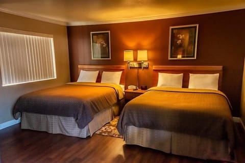 Deluxe Room, 2 Queen Beds | Individually decorated, individually furnished, desk, blackout drapes