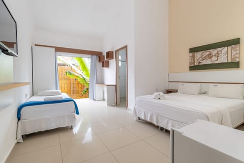 Standard Triple Room, Ground Floor | Minibar, free WiFi, bed sheets