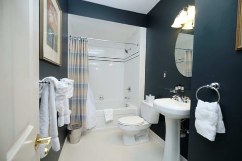 Queen Suite | Bathroom | Designer toiletries, hair dryer, towels