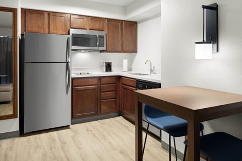 Studio, 1 King Bed, Non Smoking | Private kitchen | Full-size fridge, microwave, stovetop, dishwasher