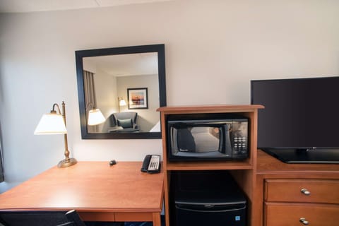 Hypo-allergenic bedding, desk, laptop workspace, blackout drapes