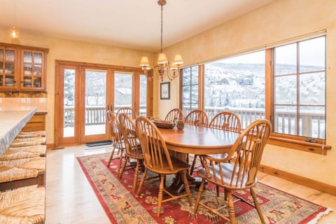 Kitchen dining table seats up to 8 with expansive alpine views