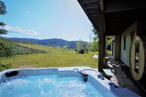 Relax in your private hot tub with breathtaking mountain views!