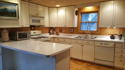 The full kitchen has everything you need for a relaxing stay, even a dishwasher