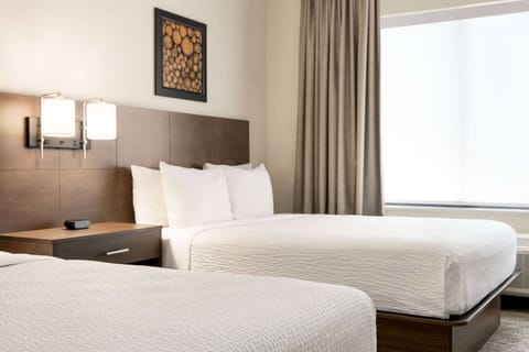 Premium bedding, down comforters, pillowtop beds, in-room safe