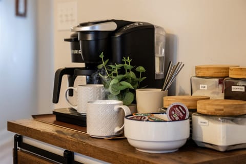 Fully stocked coffee bar with a Keurig Duo with all of the fixings.