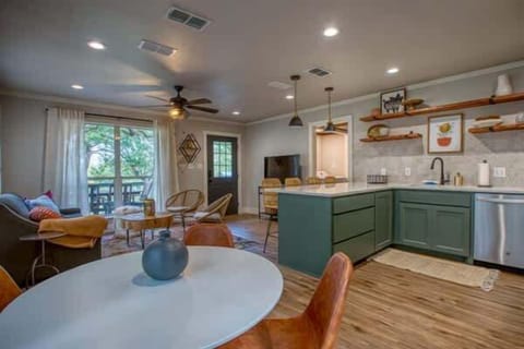 Bright, open living, dining, and kitchen area.