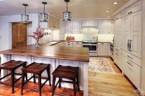 Take a seat at the breakfast bar or entertain at the dining room table.