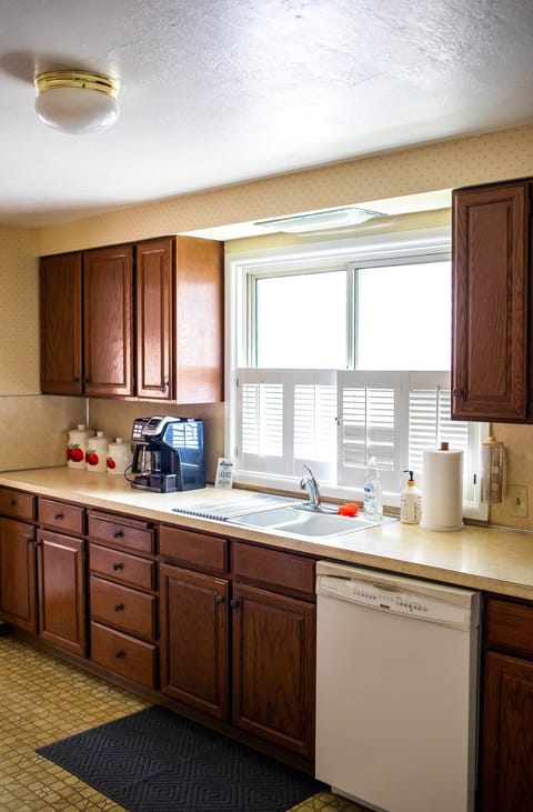 Our fully-equipped kitchen with a dishwasher, coffee maker, fridge, and more!