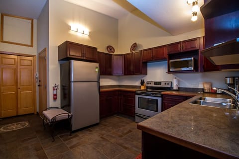 Condo | Private kitchen | Full-size fridge, microwave, oven, stovetop