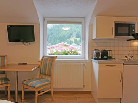 Property, Furniture, Window, Cabinetry, Kitchen Appliance, Wood, Interior Design, Architecture, Home Appliance, Chair