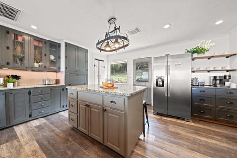 Experience the ultimate in gourmet living with our stunning copper backsplash and stainless steel appliances